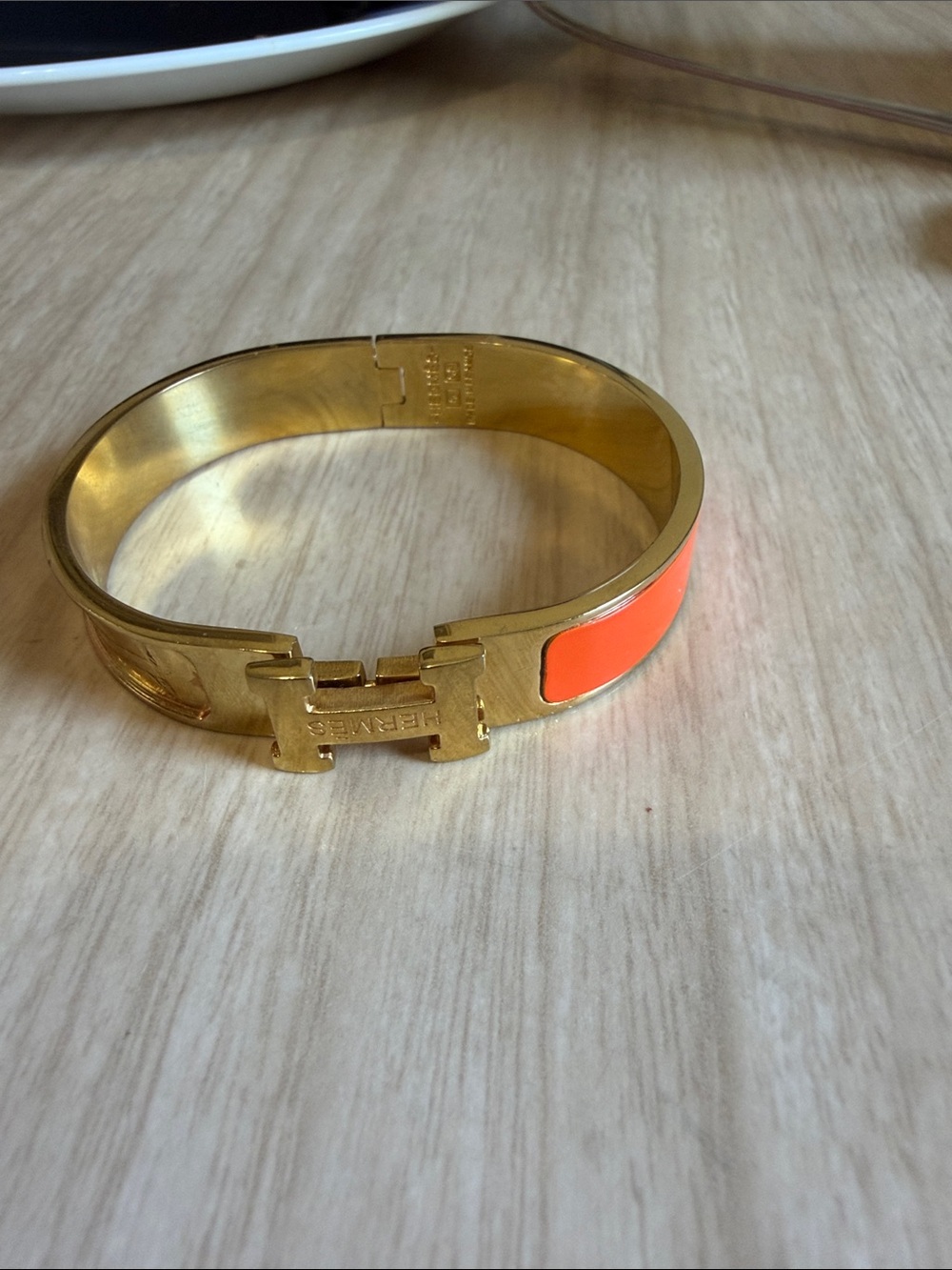 Hermès Clic H Bangle Bracelet in Gold with Orange Enamel